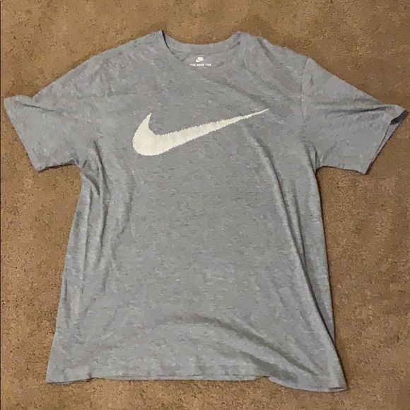 white nike shirt with grey swoosh